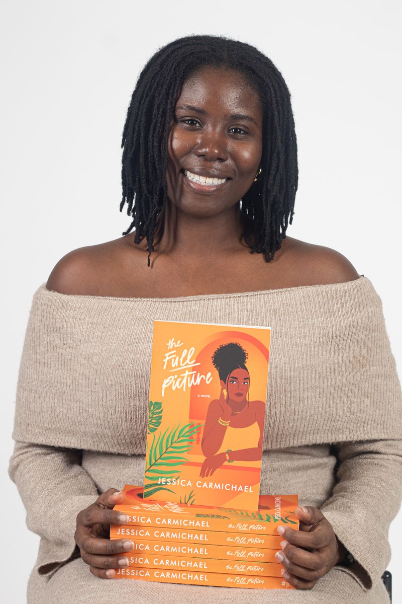 Author holding her new book