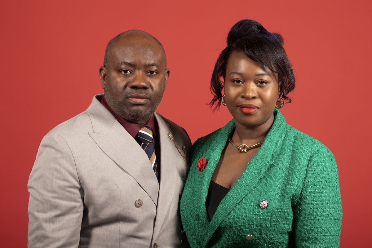Couple portrait on a red backdrop