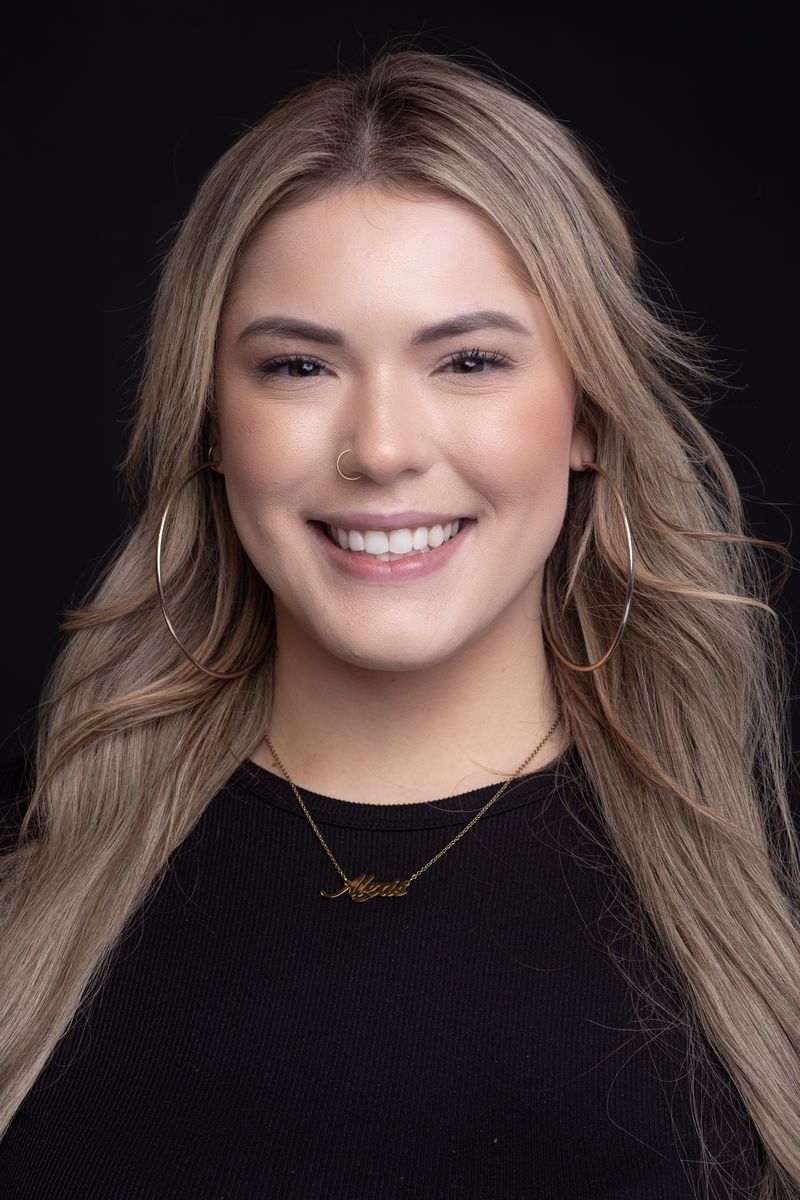 Smiling woman, studio headshot
